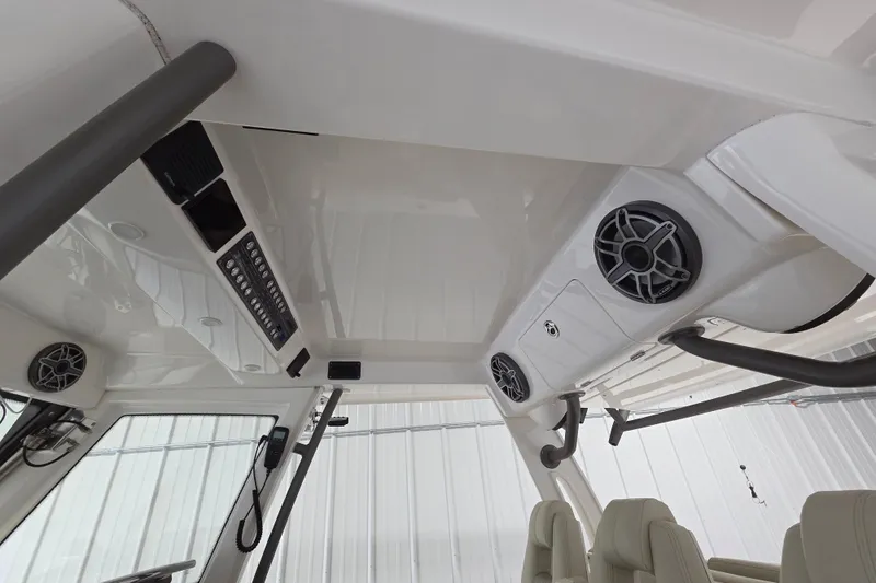 Slide: The Image of Interior view of 2020 Solace 345 boat, featuring speakers and control panel. - 28