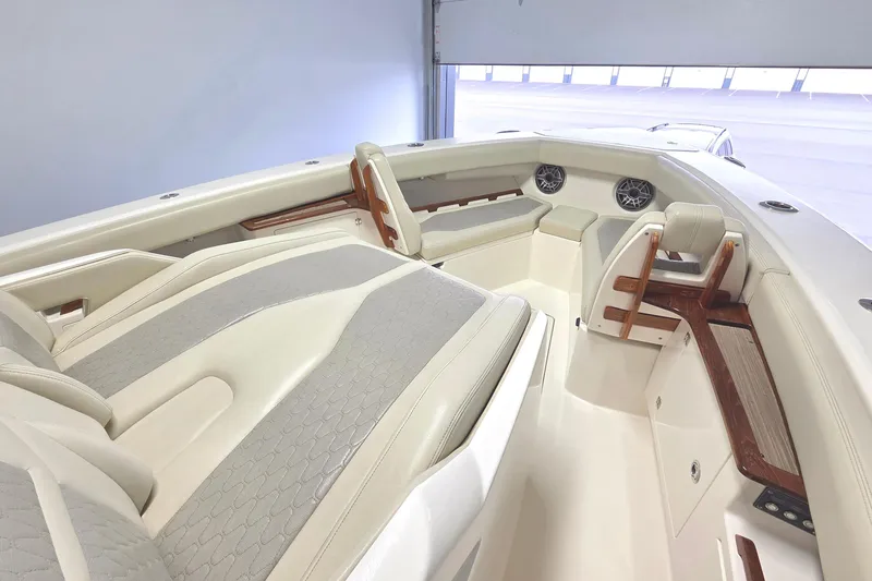 Slide: The Image of Interior of 2020 Solace 345 boat featuring luxurious seating and wood accents. - 6