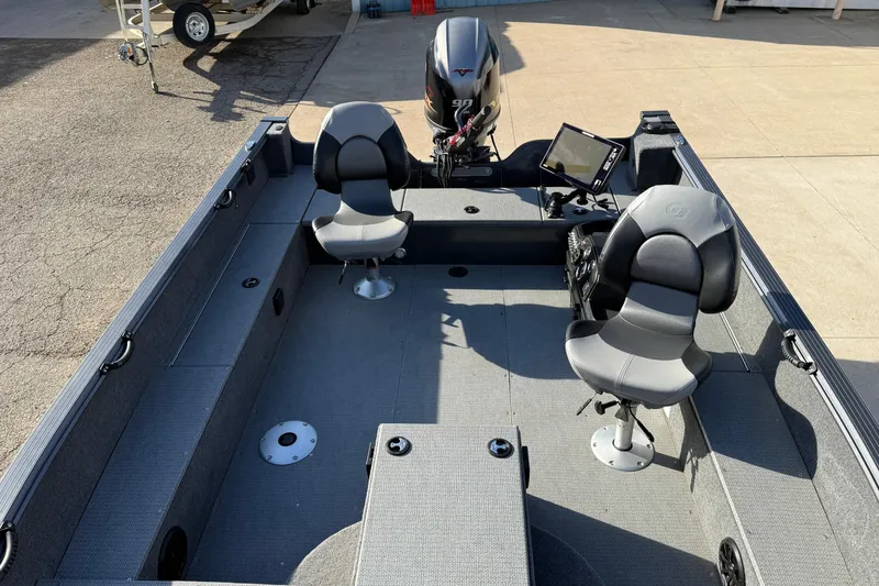 Slide: The Image of 2022 G3 Angler V17 T boat interior with two seats and a motor. - 12