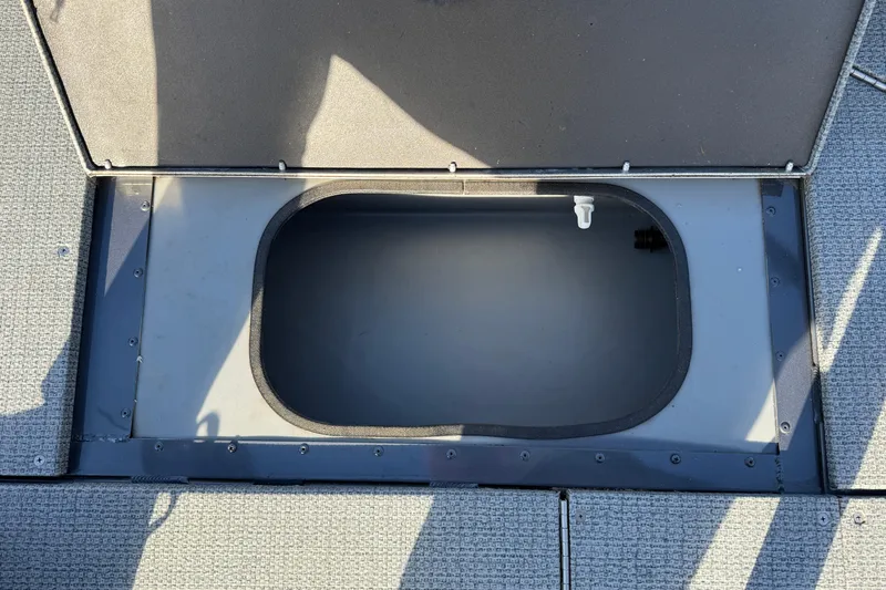 Slide: The Image of Open storage compartment on 2022 G3 Angler V17 T boat deck. - 16