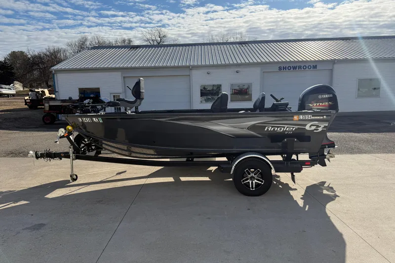 Slide: The Image of 2022 G3 Angler V17 T fishing boat on trailer outside showroom. - 4