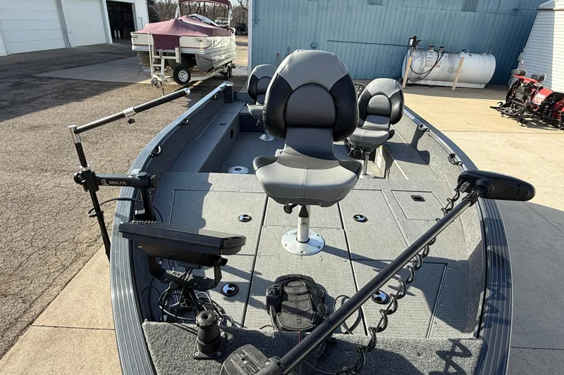 Slide: The Image of 2022 G3 Angler V17 T fishing boat with seating and equipment, parked outdoors. - 8