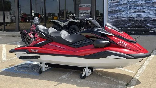Slide: The Image of 2026 Yamaha WaveRunner FX Cruiser HO in red, parked on a lot. - 3