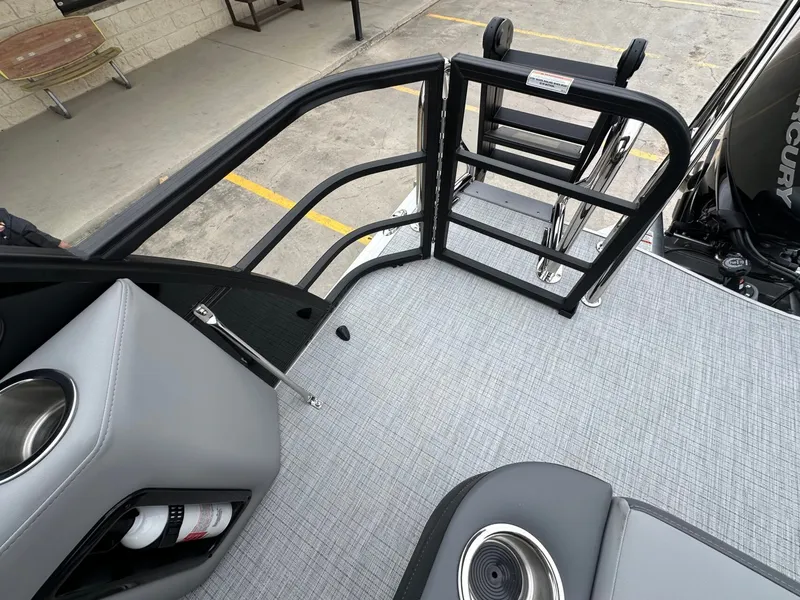 Slide: The Image of Trifecta 22 UL CS 2026 boat with gray deck and safety railing. - 10