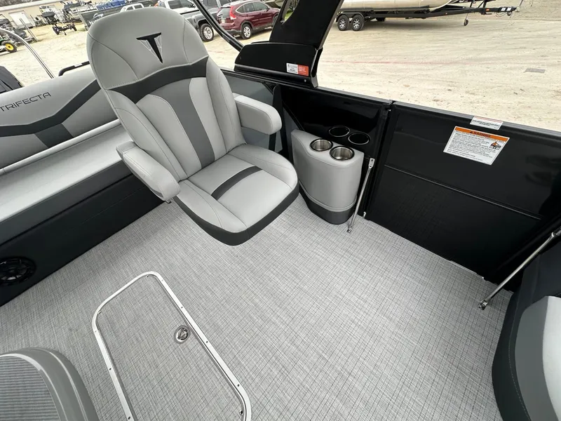 Slide: The Image of Interior of 2026 Trifecta 22 UL CS with gray seating and cup holders. - 31