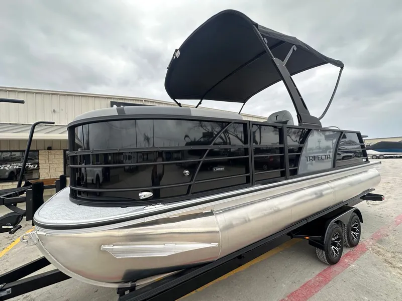 Slide: The Image of 2026 Trifecta 22 UL CS pontoon boat with black canopy. - 9