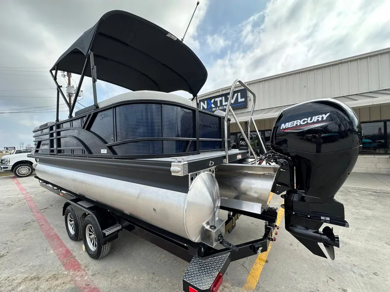 Slide: The Image of 2026 Bennington 22 S STERN RADIUS with Mercury engine on trailer. - 3