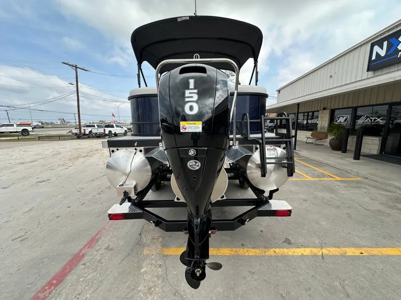 Slide: The Image of Bennington 22 S STERN RADIUS 2026 with outboard motor in parking lot. - 4