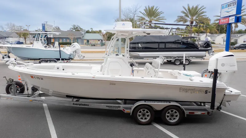 Slide: The Image of 2020 Everglades 243 Center Console boat on trailer outdoors. - 4