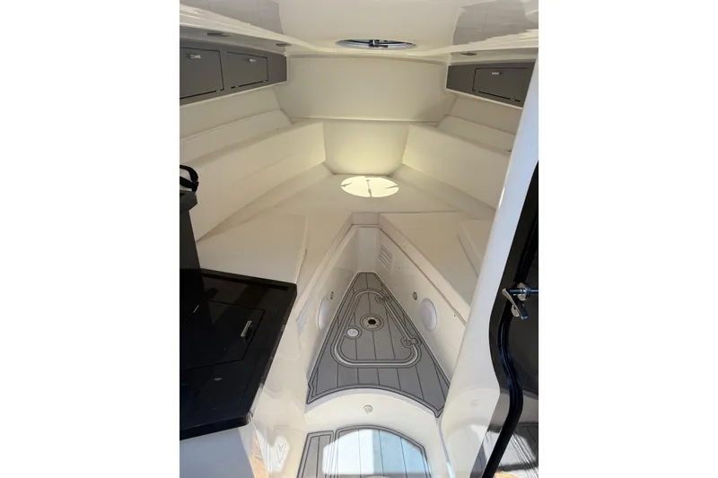 Slide: The Image of Interior cabin of 2021 Schaefer 303 boat, featuring sleek design and modern amenities. - 27