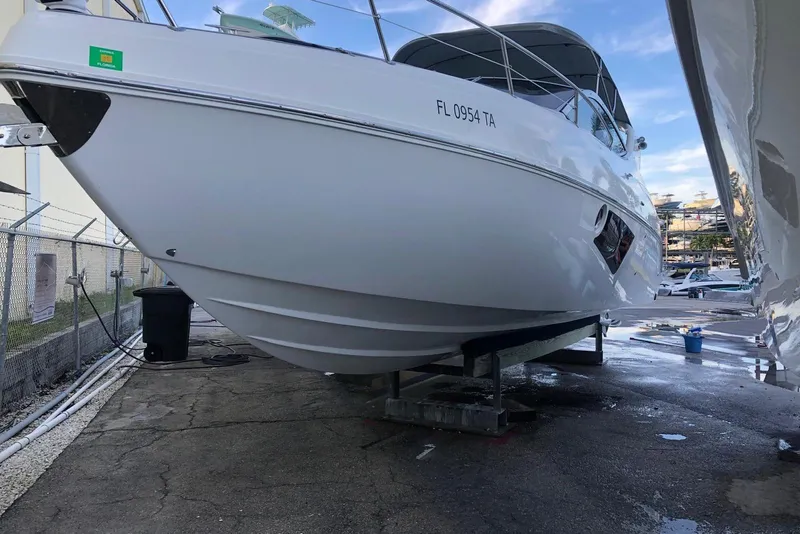 Slide: The Image of 2021 Schaefer 303 boat on dry dock, Florida registration visible. - 3