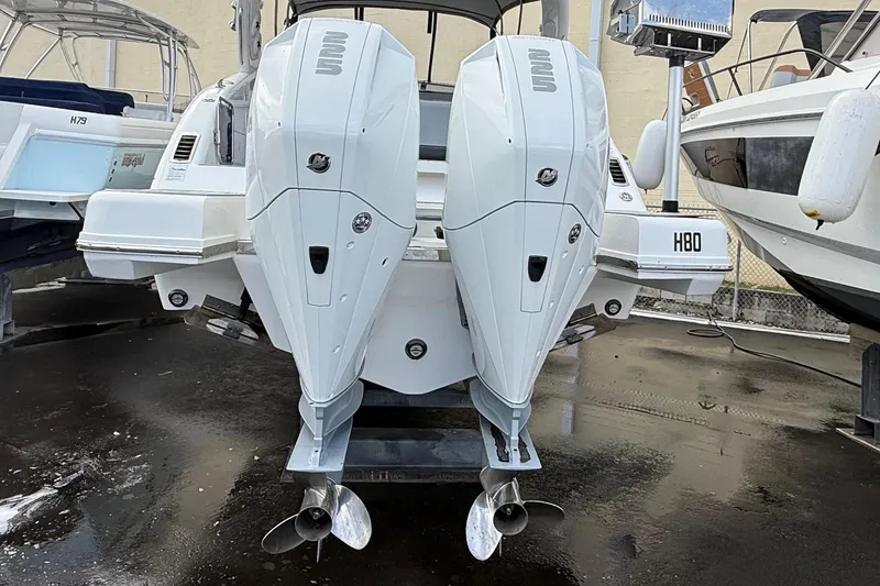 Slide: The Image of Schaefer 303 boat from 2021 with dual outboard engines. - 31