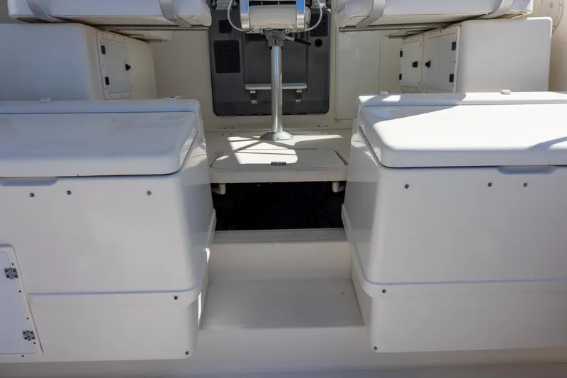 Slide: The Image of 1997 Tiara Yachts 3500 Express interior seating and storage area. - 13