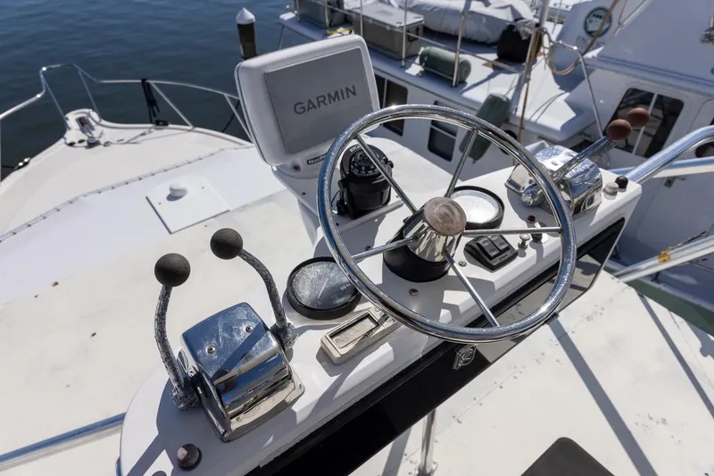 Slide: The Image of Helm of 1997 Tiara Yachts 3500 Express with Garmin navigation system. - 15