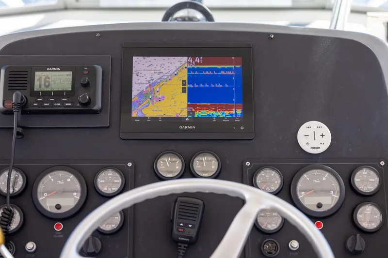 Slide: The Image of Dashboard of a 1997 Tiara Yachts 3500 Express with Garmin navigation system. - 21