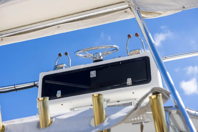 Slide: The Image of 1997 Tiara Yachts 3500 Express helm with blue sky background. - 27