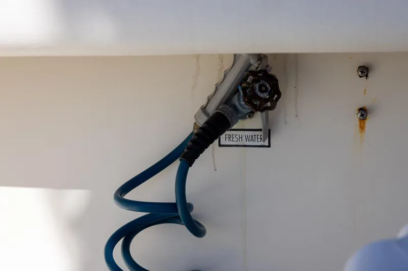 Slide: The Image of Fresh water hose connection on 1997 Tiara Yachts 3500 Express boat. - 28