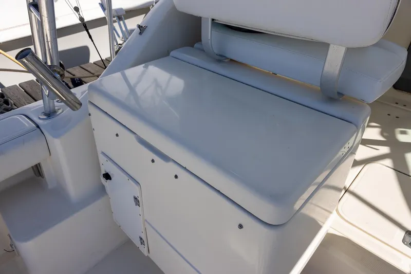 Slide: The Image of 1997 Tiara Yachts 3500 Express boat seating and storage area. - 31