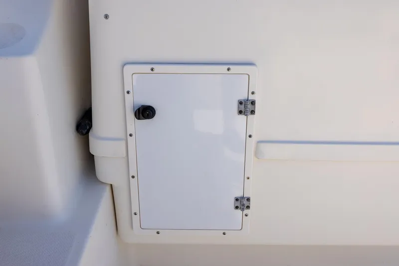 Slide: The Image of Access panel on 1997 Tiara Yachts 3500 Express boat, featuring a white hinged door. - 33