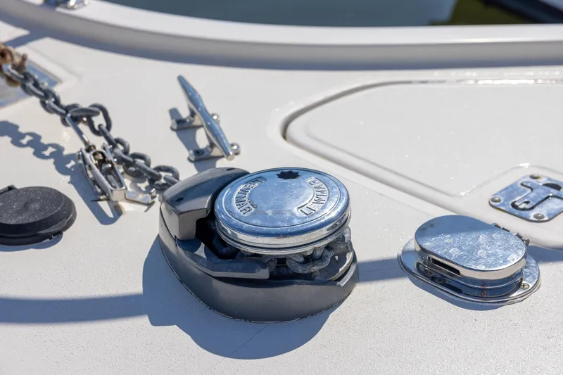 Slide: The Image of Anchor windlass on 1997 Tiara Yachts 3500 Express deck, showcasing marine hardware. - 37
