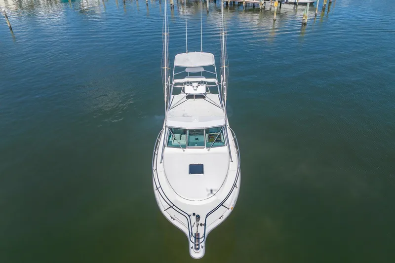 Slide: The Image of Aerial view of a 1997 Tiara Yachts 3500 Express boat docked in calm waters. - 7