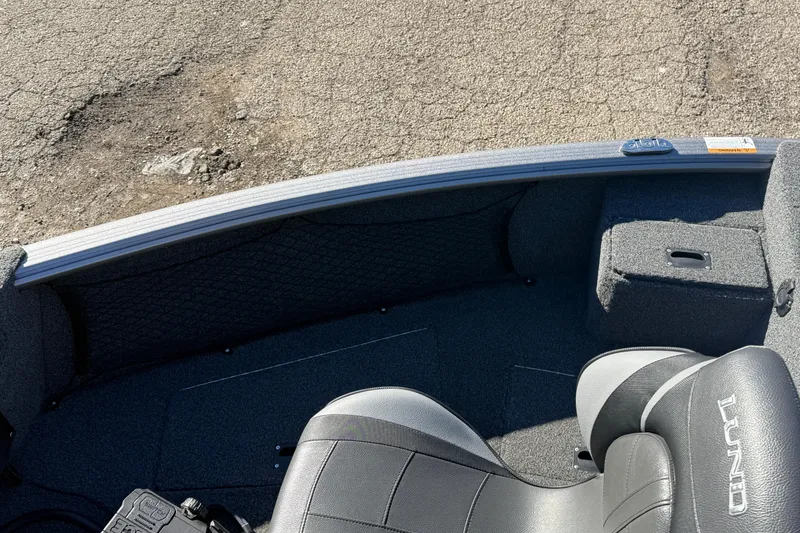 Slide: The Image of 2020 Lund 1875 Impact XS boat interior with seating and storage compartments. - 12