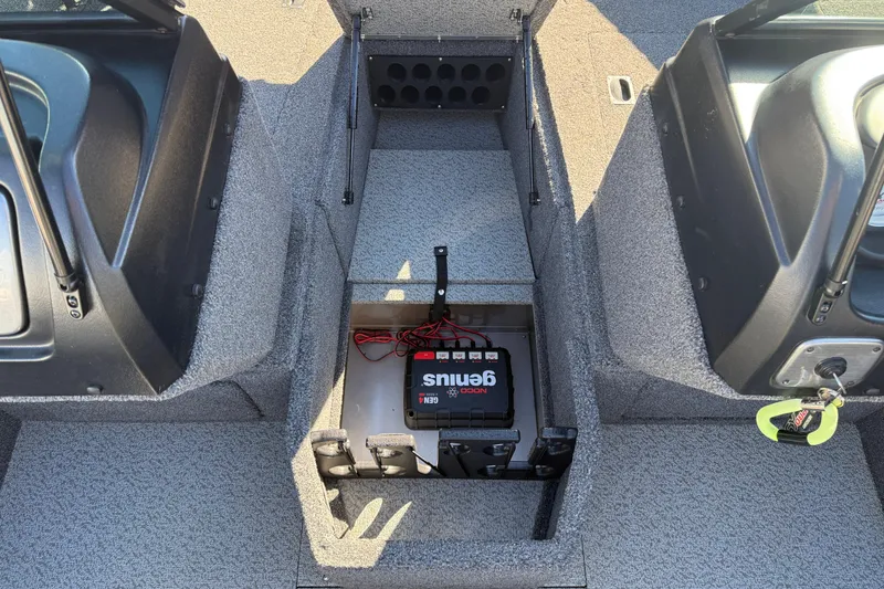 Slide: The Image of 2020 Lund 1875 Impact XS boat interior with battery compartment and storage. - 16