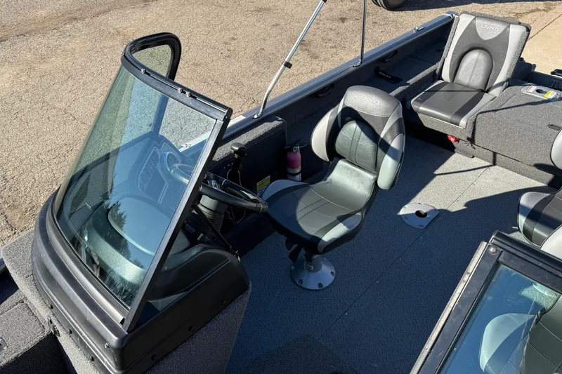 Slide: The Image of 2020 Lund 1875 Impact XS boat interior with seating and steering console. - 18