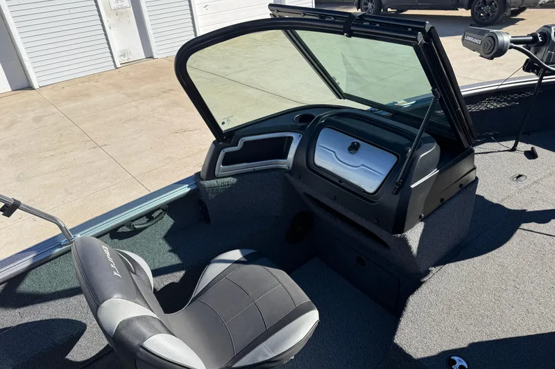 Slide: The Image of 2020 Lund 1875 Impact XS boat interior with seating and control panel. - 23