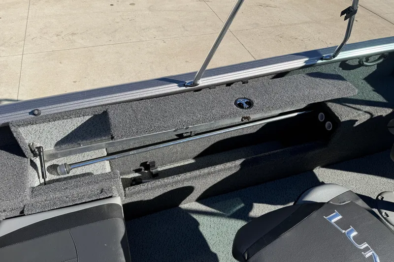 Slide: The Image of 2020 Lund 1875 Impact XS boat interior with open storage compartment and seating. - 29