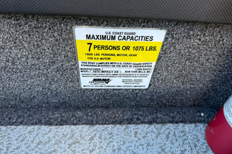 Slide: The Image of U.S. Coast Guard capacity label on 2020 Lund 1875 Impact XS boat, 7 persons or 1075 lbs. - 36