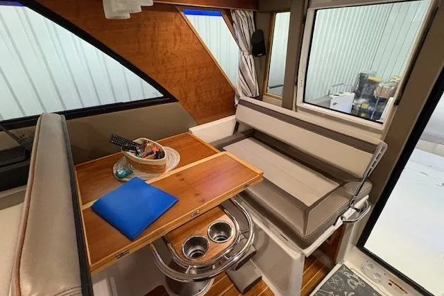 Slide: The Image of Interior of 2022 Cutwater C-30 Sedan with dining area and seating. - 17