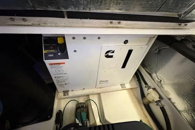 Slide: The Image of Engine compartment of a 2022 Cutwater C-30 Sedan, featuring an Onan generator. - 25