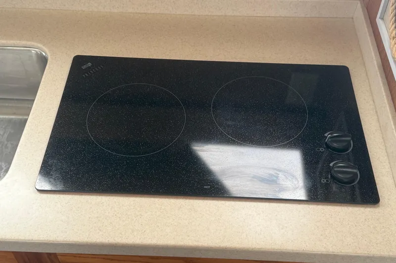 Slide: The Image of Ceramic cooktop on 1987 Mainship 36 Nantucket Sedan yacht kitchen counter. - 21