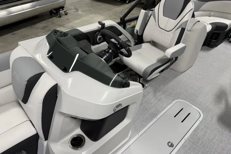 Slide: The Image of 2026 Avalon LSZ Quad Lounge boat interior with modern helm and comfortable seating. - 11
