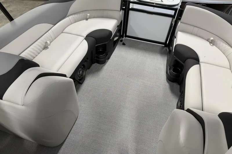 Slide: The Image of Luxurious seating in 2026 Avalon LSZ Quad Lounge boat, featuring elegant upholstery and cup holders. - 15