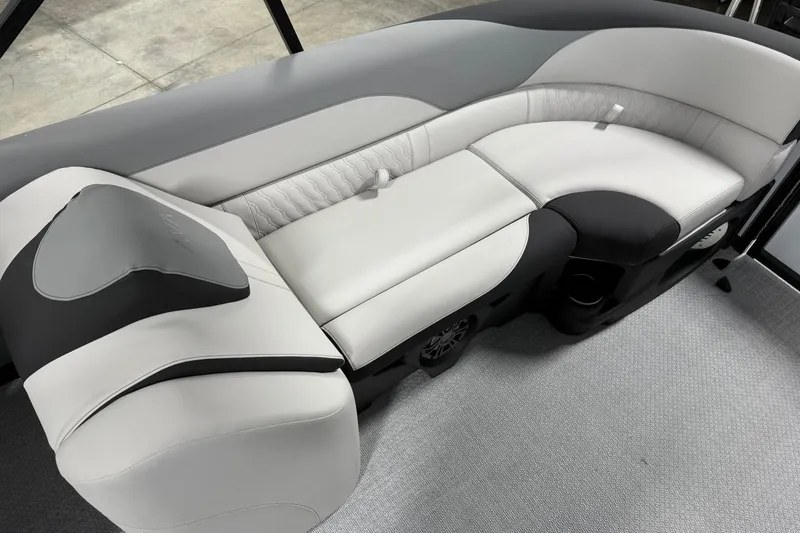 Slide: The Image of 2026 Avalon LSZ Quad Lounge 23' boat interior with sleek, modern seating design. - 17