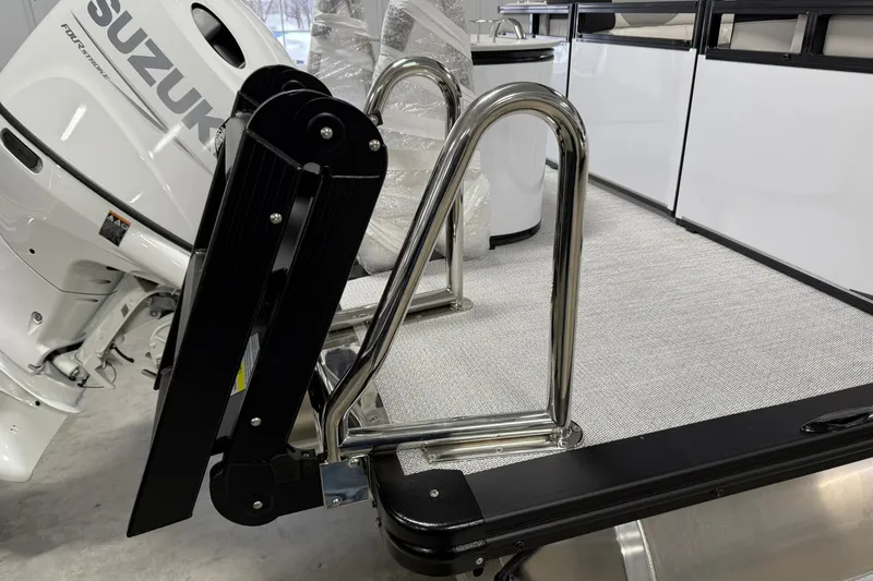 Slide: The Image of 2026 Avalon LSZ Quad Lounge boat with Suzuki motor and stainless steel ladder. - 6