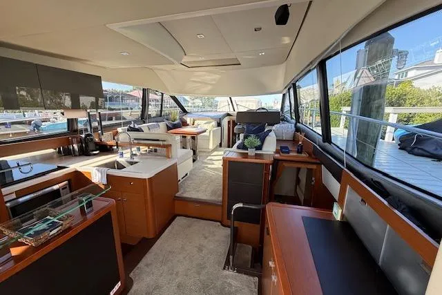 Slide: The Image of Spacious deck of 2015 Prestige 500 yacht with seating and wooden table. - 21