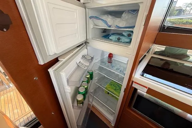 Slide: The Image of Control panel of a 2015 Prestige 500 yacht, featuring joystick and digital display. - 25