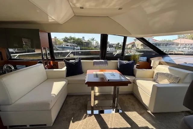 Slide: The Image of Open refrigerator on 2015 Prestige 500 yacht, stocked with drinks and ice. - 31