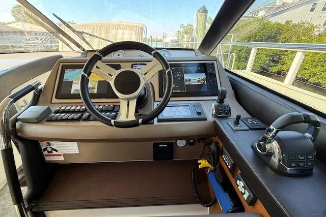 Slide: The Image of Luxurious interior of a 2015 Prestige 500 yacht with elegant seating and panoramic windows. - 34