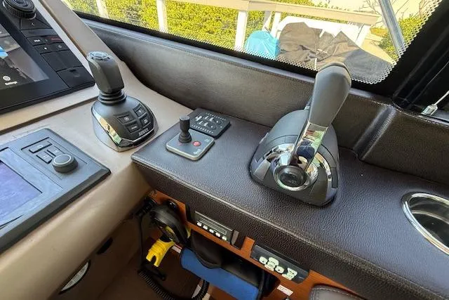 Slide: The Image of Interior of a 2015 Prestige 500 yacht, featuring a sleek, modern seating area. - 39