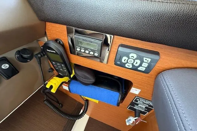 Slide: The Image of Cockpit of a 2015 Prestige 500 yacht with modern navigation controls and steering wheel. - 40