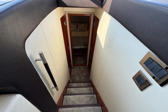 Slide: The Image of Dashboard of a 2015 Prestige 500 yacht with navigation display and controls. - 41