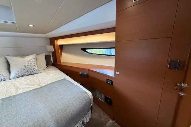 Slide: The Image of Control panel of a 2015 Prestige 500 yacht with joystick and throttle levers. - 45