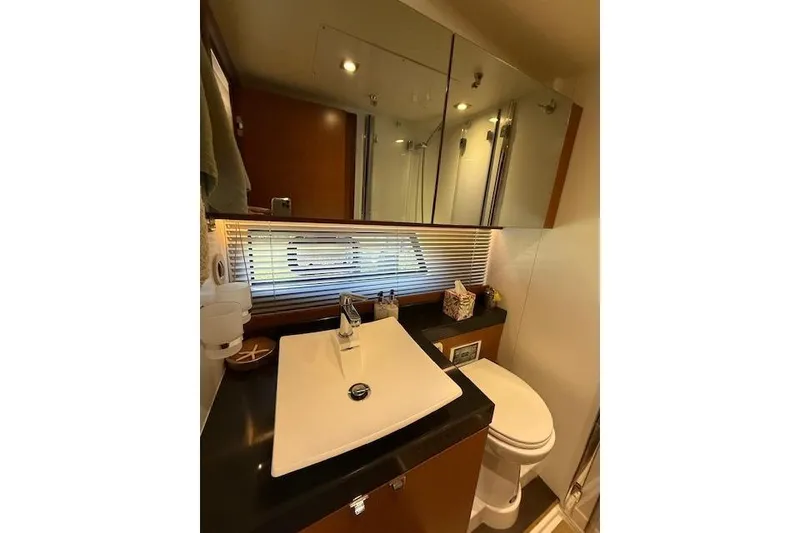 Slide: The Image of Luxurious bedroom interior of a 2015 Prestige 500 yacht with elegant bedding. - 49