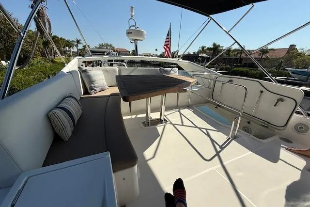 Slide: The Image of Luxurious interior of a 2015 Prestige 500 yacht with cozy seating and window view. - 63