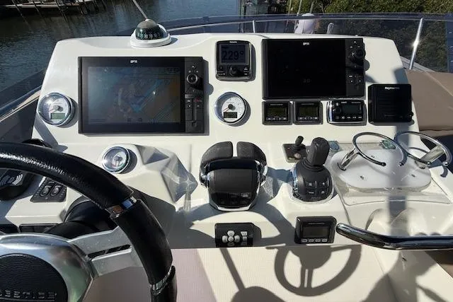 Slide: The Image of Shower area inside a 2015 Prestige 500 yacht, featuring a wooden floor mat. - 67