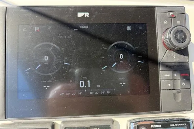 Slide: The Image of Luxurious 2015 Prestige 500 yacht deck with seating, table, and American flag. - 69